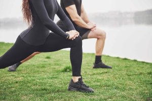 Man & Woman Exercising Outdoors